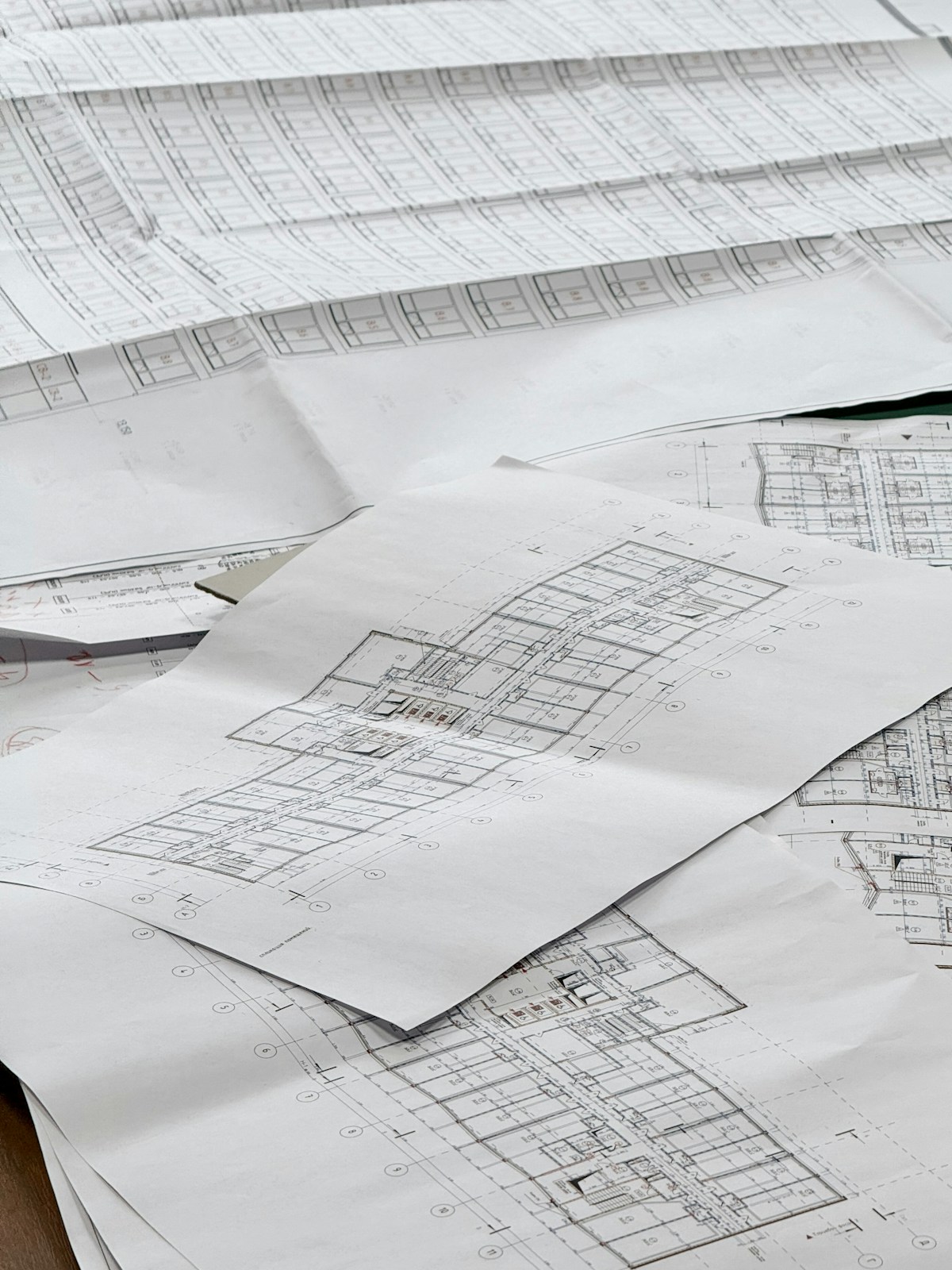 Architectural drawings spread across a table